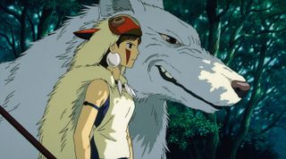 a girl in an animal headdress standing by a giant white wolf in a still from Princess Mononoke