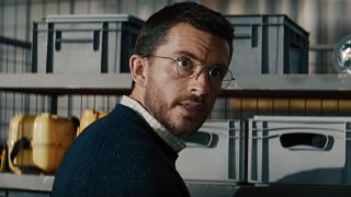 Jonathan Bailey's Dr. Loomis looking confused in his first Jurassic World Rebirth scene.