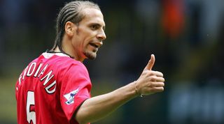 London, UNITED KINGDOM: Rio Ferdinand of Manchester United gestures to a teammate against Tottenham Hotspur during the Premiership match at White Hart Lane in London 17 April 2005. Manchester United won the game 2-1. AFP PHOTO ADRIAN DENNIS Mobile and website uses of domestic English football pictures subject to subscription of a license with Football Association Premier League (FAPL) tel : +44 207 298 1656. For newspapers where the football content of the printed and electronic versions are identical, no licence is necessary. (Photo credit should read ADRIAN DENNIS/AFP via Getty Images)