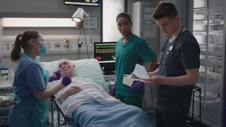 Archie by Vincent's bedside with Will and Jade from previous episode of Casualty