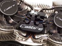In the middle there are four holes per fan that serve as latching points for the cooler wings