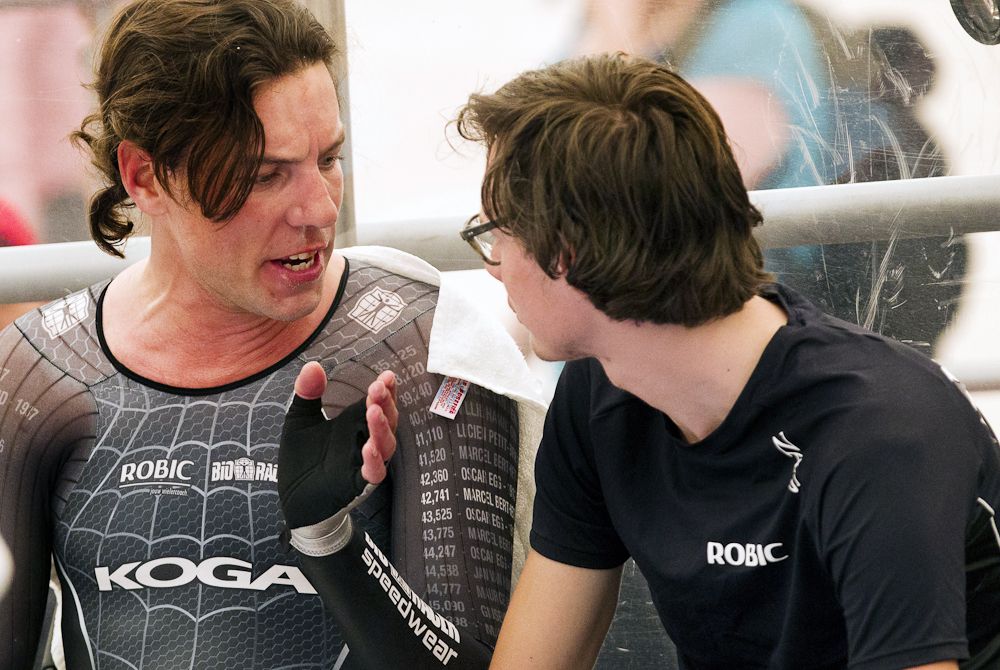 Dutch cyclist Thomas Dekker and his coach Leon Burger react at the end of the race during the UCI world hour record attempt at the bicentennial velodrome.