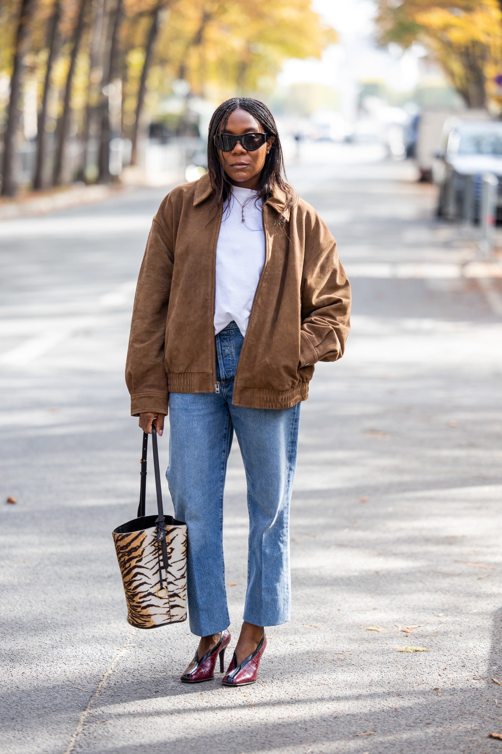 Photo of a Paris Fashion Week guest wearing French girl denim and jeans trends