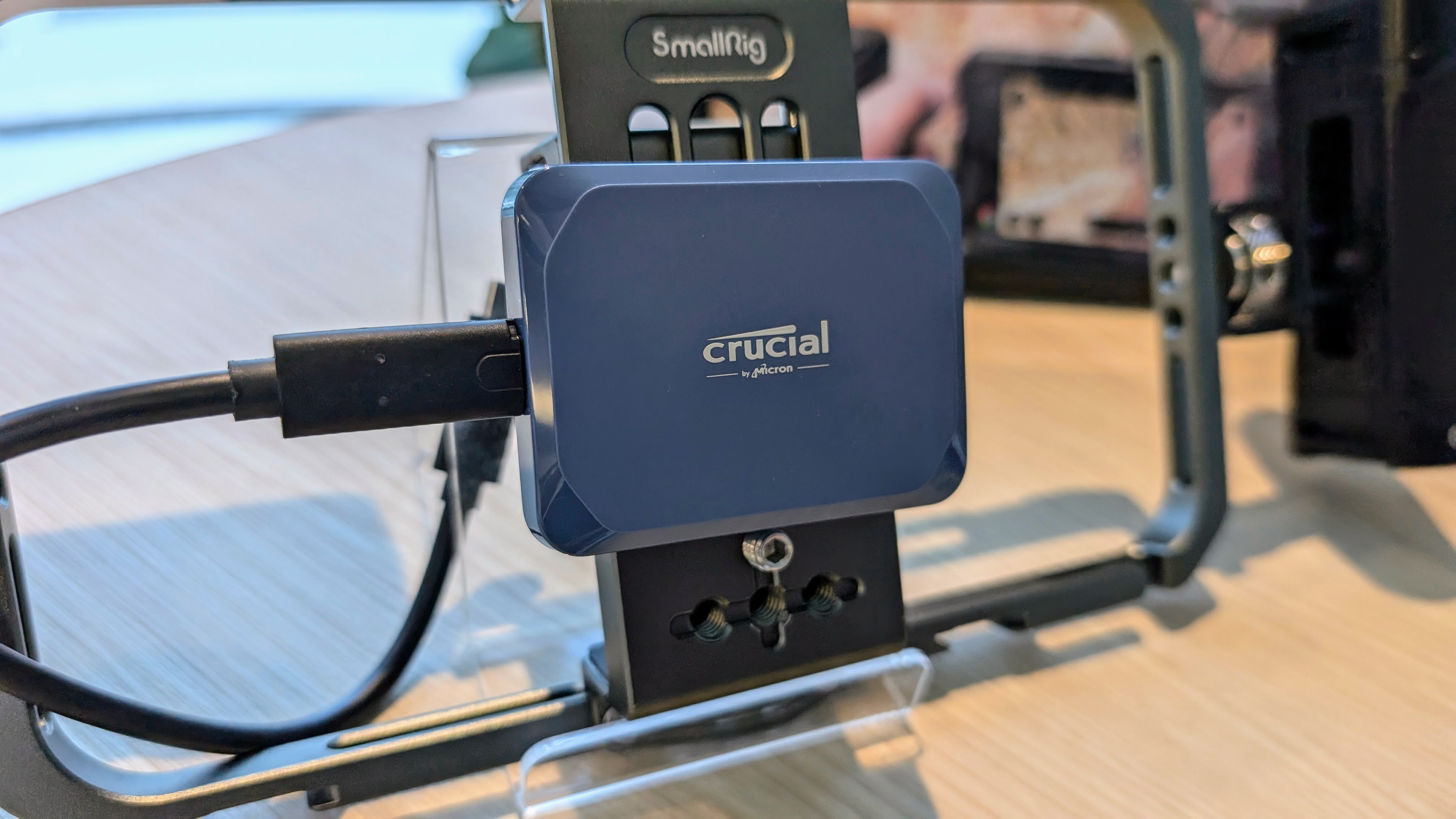 Crucial X10 portable SSD on SmallRig phone holder at Computex 2025