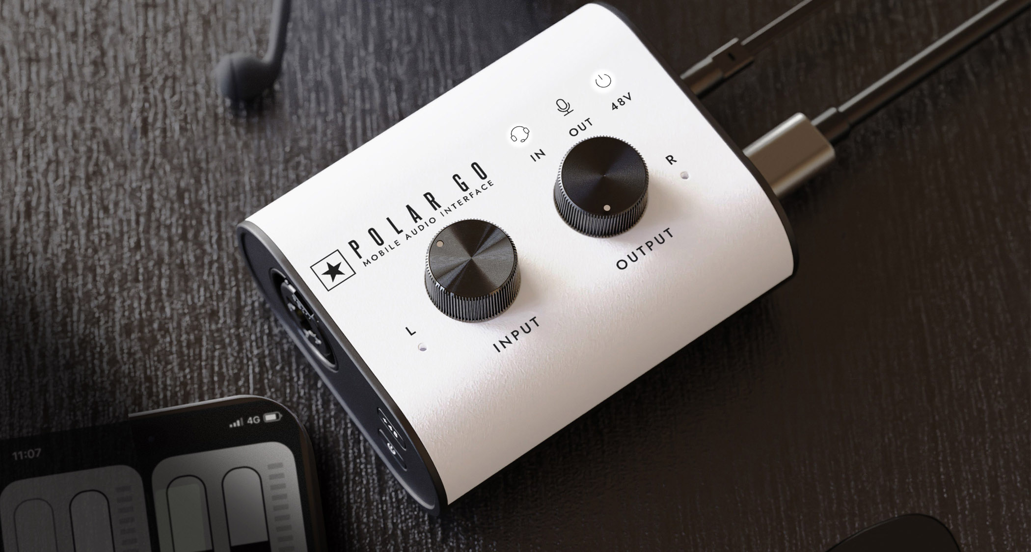 Blackstar Amplification Polar Go: the super-compact audio interface has a white fascia, black knobs and sides, and is small enough to fit inside the palm of your hand.