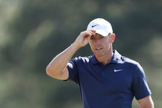 Rory McIlroy touches his cap