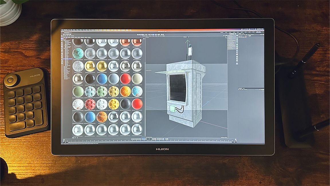 Huion Kamvas Pro 19 review; a pen display on a wooden table