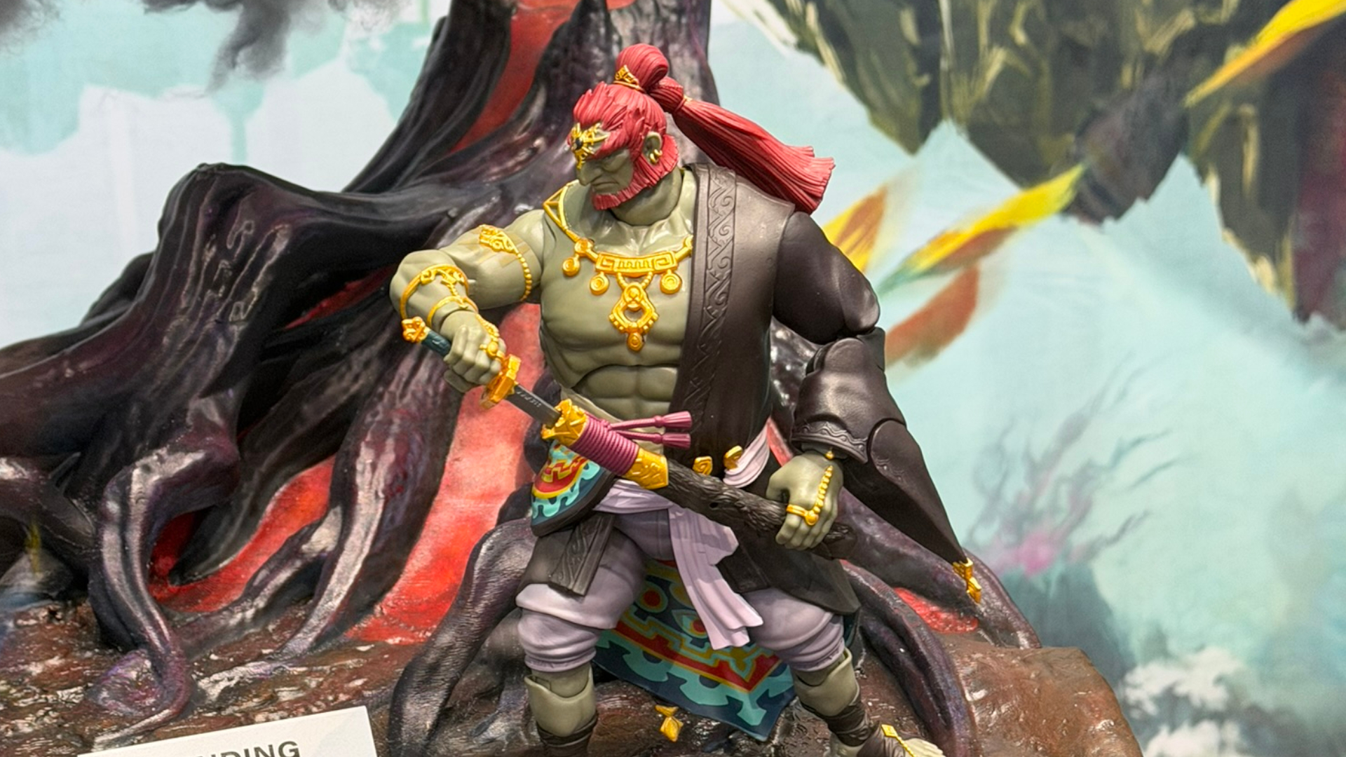 A Ganondorf action figure draws his sword against a gloom-filled environment