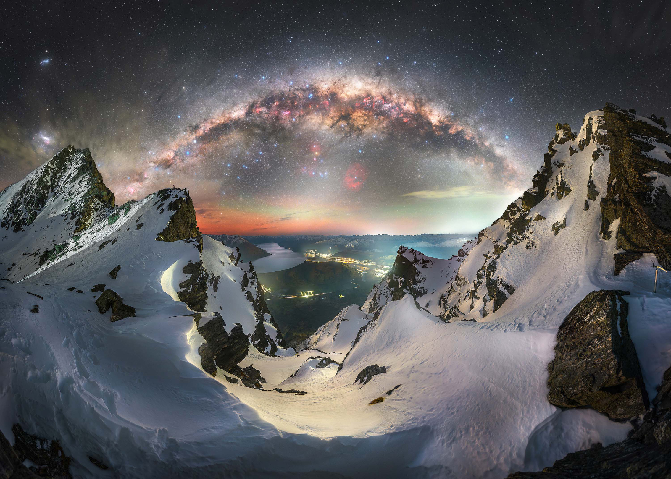 A breathtaking view of the Milky Way galaxy illuminating a mountain range under a clear night sky
