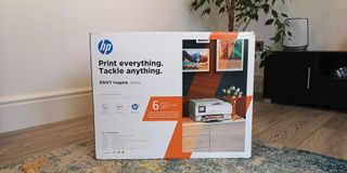 Image shows the HP Envy Inspire in its box.