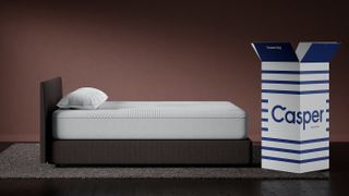 Best Casper mattress deals, sales and promo codes: The Casper Nova Hybrid Mattress shown on a brown bed next to a deep pink wall