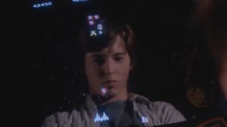 Matthew Broderick's reflection on a screen for the arcade game Space Invaders in WarGames