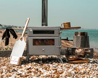 woodburning stove on a pebble beach
