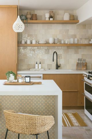 Oak kitchen with white marble countertop and beige tiles