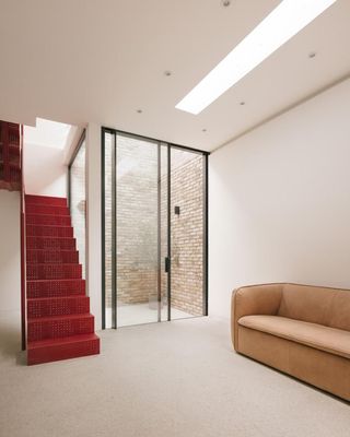 Red staircase in East London house