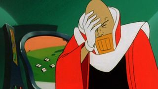 An evil Pac-Man villain covering his face