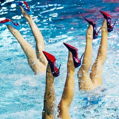 three models wear Louboutin heels underwater in a performance highlighting the Miss Z pump