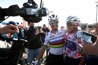 Julian Alaphilippe and Remco Evenepoel celebrate after the pair combined to take stage 2 victory in Viana