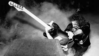 Ritchie Blackmore performing live onstage during the California Jam tour, smashing guitar against amplifier on US tour, 6th April 1974.