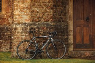 Image shows a bike leant up against a wall.