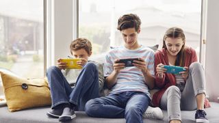 Family playing Nintendo Switch Lites