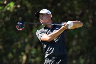 Collin Morikawa looks worried after hitting a wayward drive