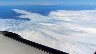 A wider view of the calving front of Jakobshavn Glacier, as seen from a NASA research plane flying overhead.