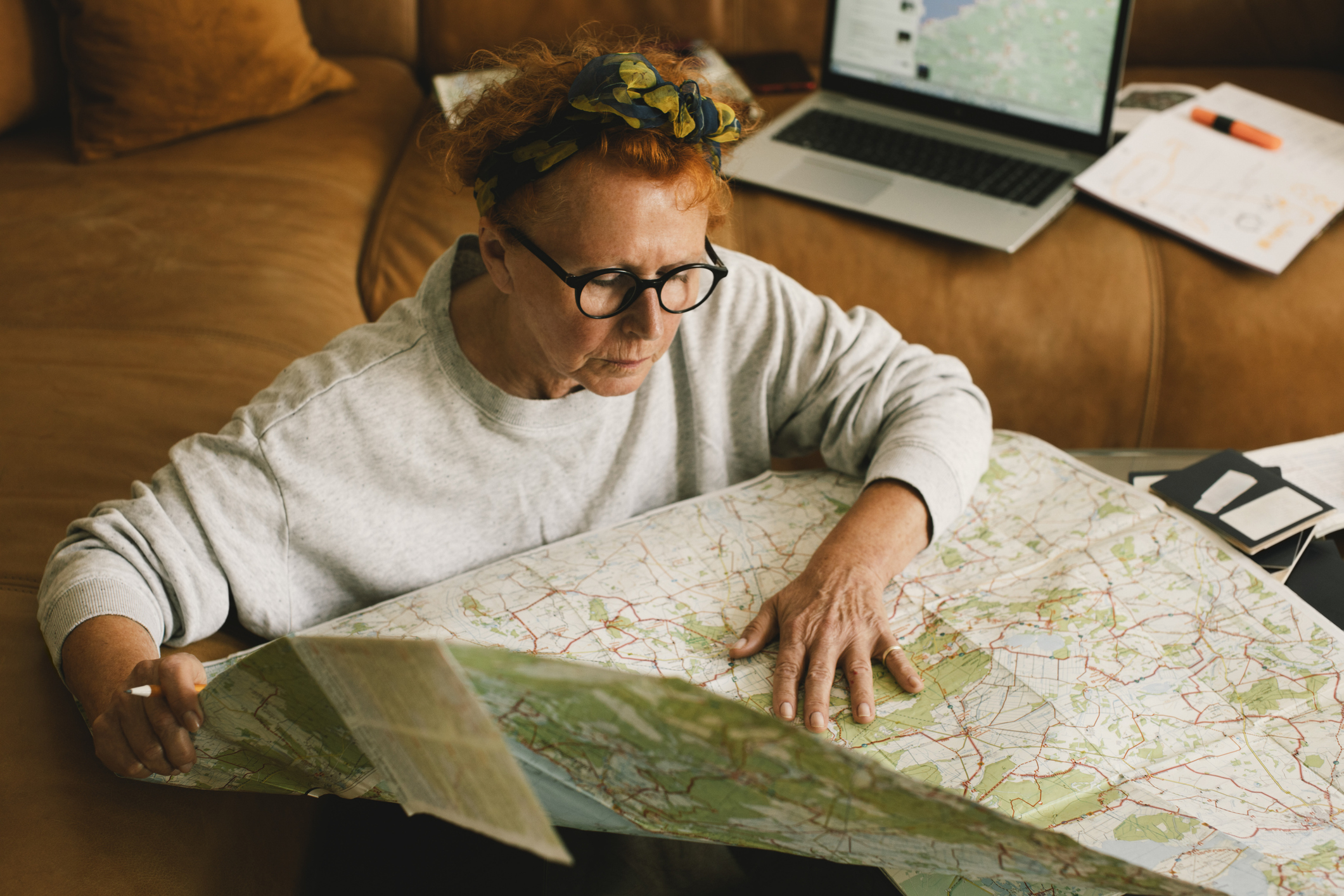 Pensioner looking at a map