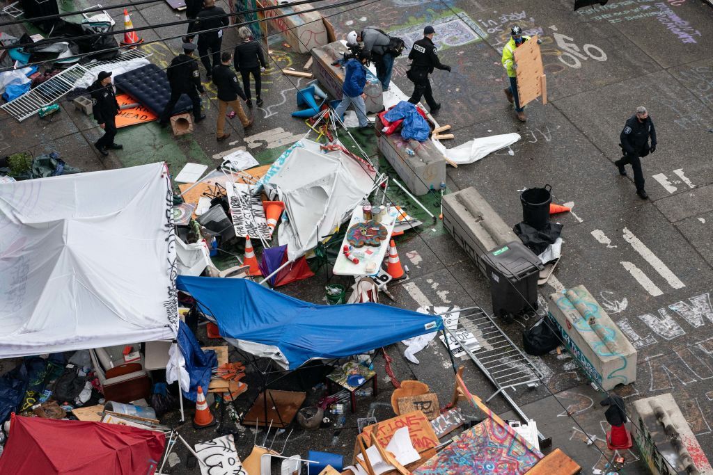 Seattle police clear out CHOP zone.