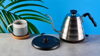 hario v60 buono gooseneck kettle, a stainless steel kettle with electric base, handle, and gooseneck spout, for specialty coffee