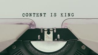 Typewriter with words: Content Is King typed out