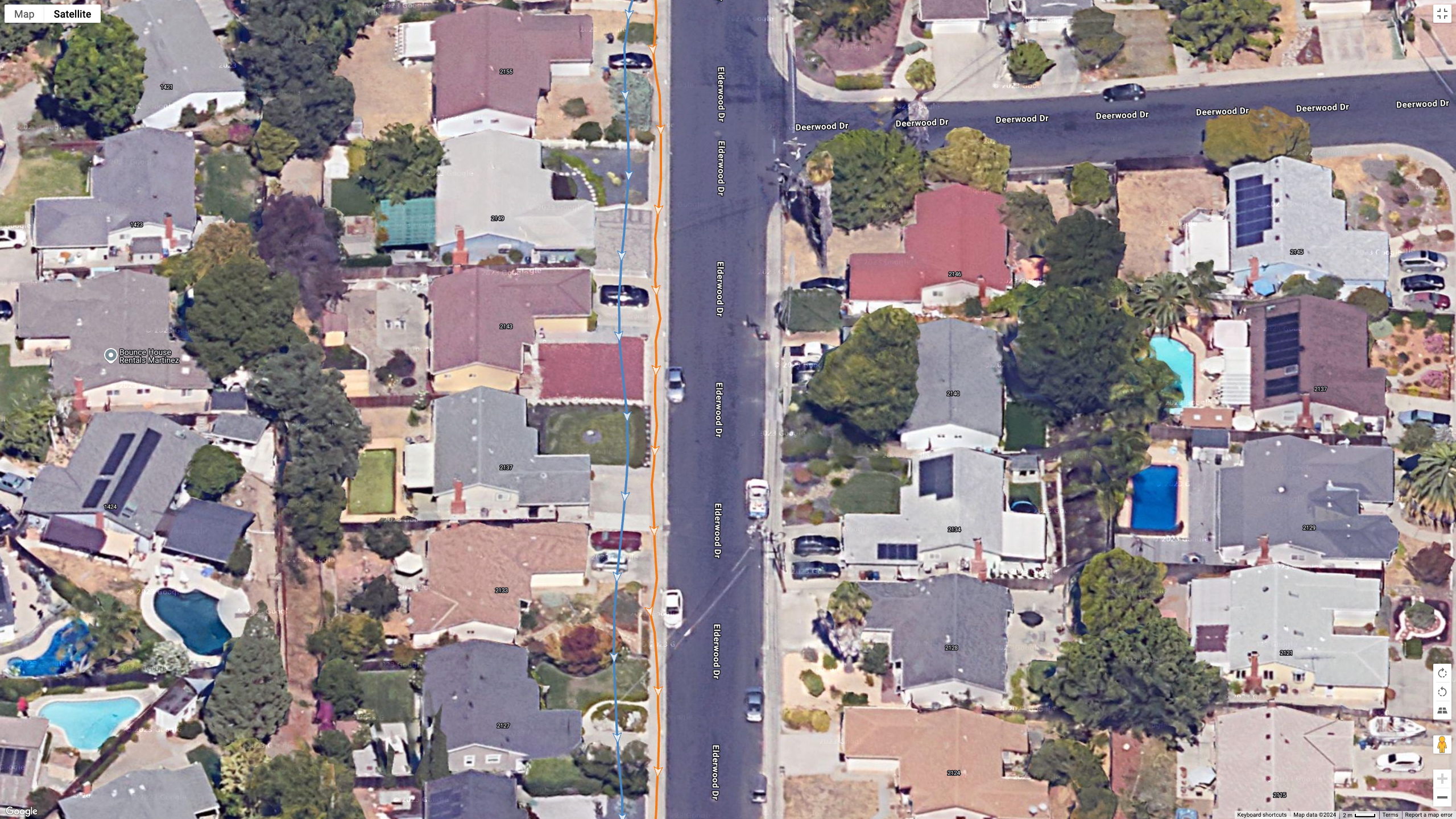 A Google Earth satellite image showing GPS lines for the COROS PACE Pro (blue) and Garmin Fenix 8 (orange) to test their dual-band GPS accuracy.