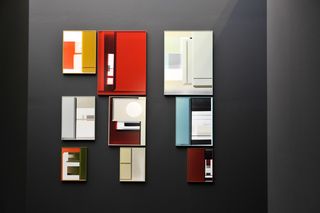 Nine rectangular frames in multiple colours and different sizes.
