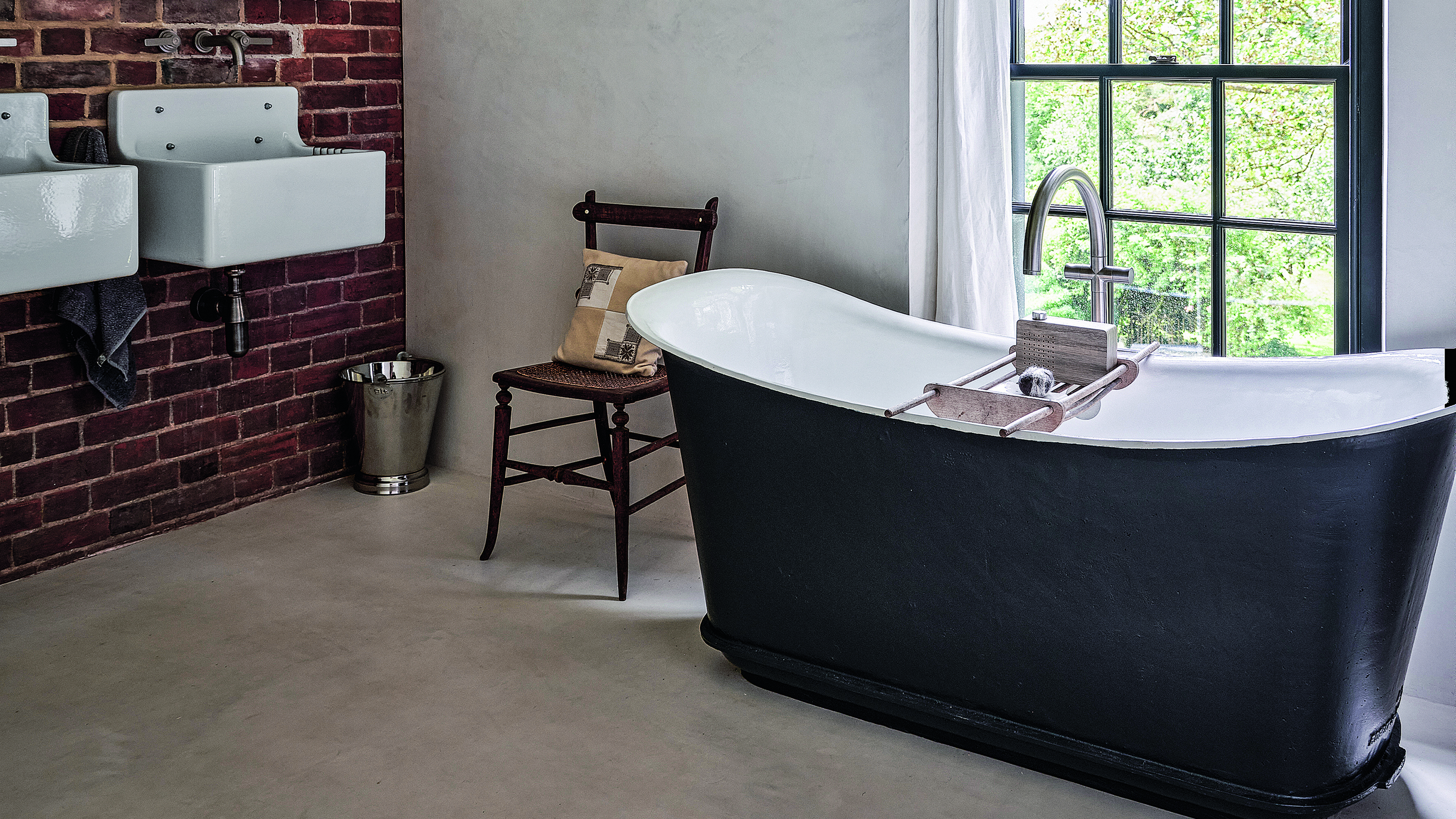 Black bath tube in bathroom