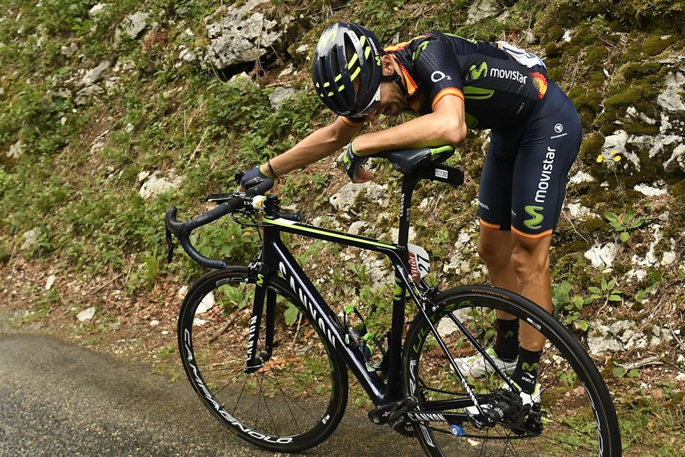 Spain's Jesus Herrada waits along the road after falling