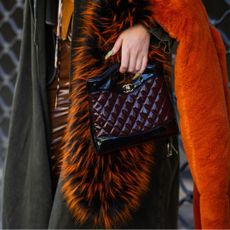 solid perfumes-street style paris fashion week woman with leather handbag and bright manicure