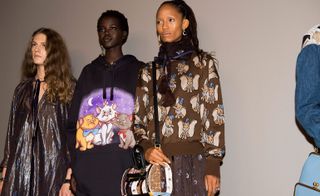 Models wear shimmery dress and cartoon jumpers