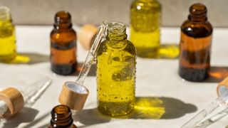 Mustard oil for hair in bottles with pipettes