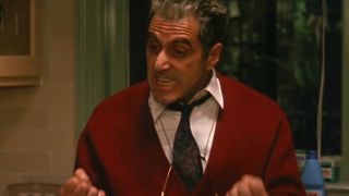 Al Pacino gestures intensely while talking in the kitchen in The Godfather Part III.