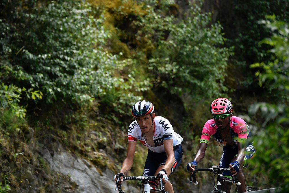 France's Jerome Coppel (R) and Ethiopia's Tsgabu Grmay (L) ride during the 184,5 km ninth stage of the 103rd edition of the Tour de France cycling race on July 10, 2016 between Vielha Val d'Aran and Andorre Arcalis
