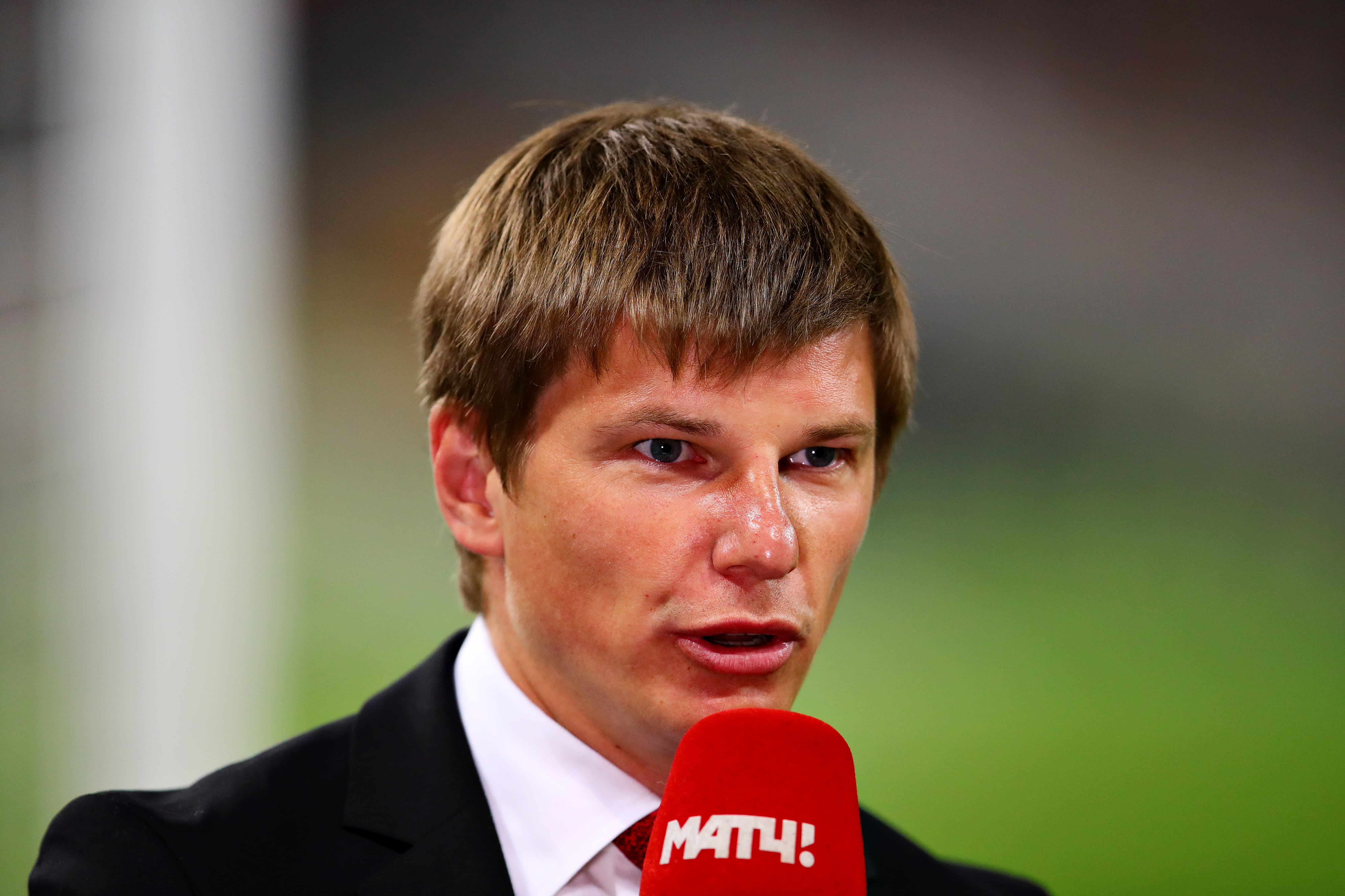 Andrey Arshavin working on television during coverage of the Europa League final between Arsenal and Chelsea in 2019.