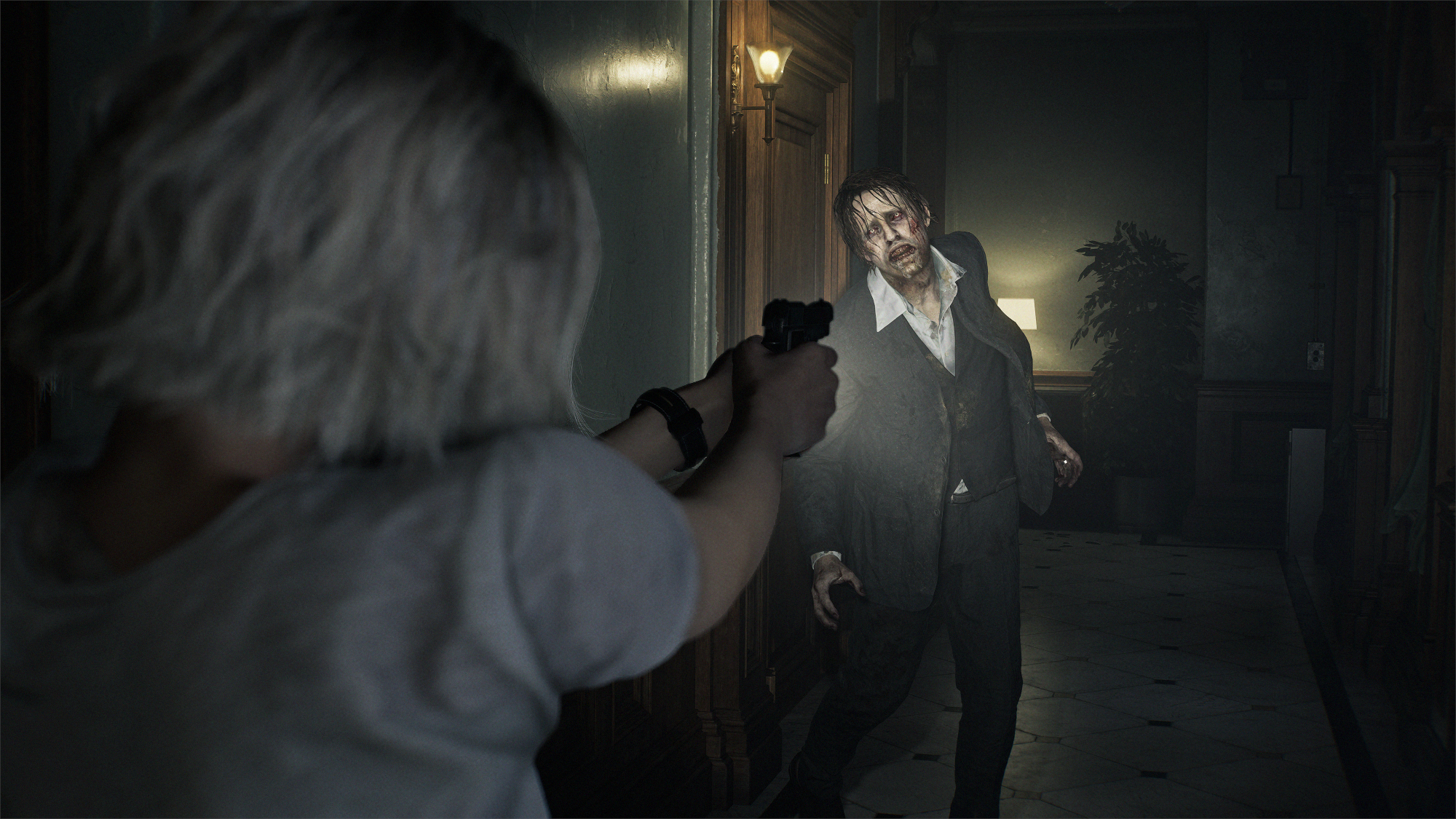 Resident Evil Requiem: Grace aims her gun at a zombie.