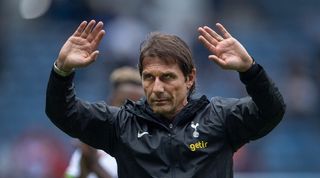 Antonio Conte waves to the Tottenham fans during his side's friendly against Rangers.