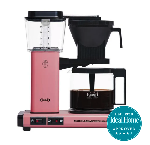 A pink Moccamaster filter coffee machine on a white background with the 5-star Ideal Home approved badge