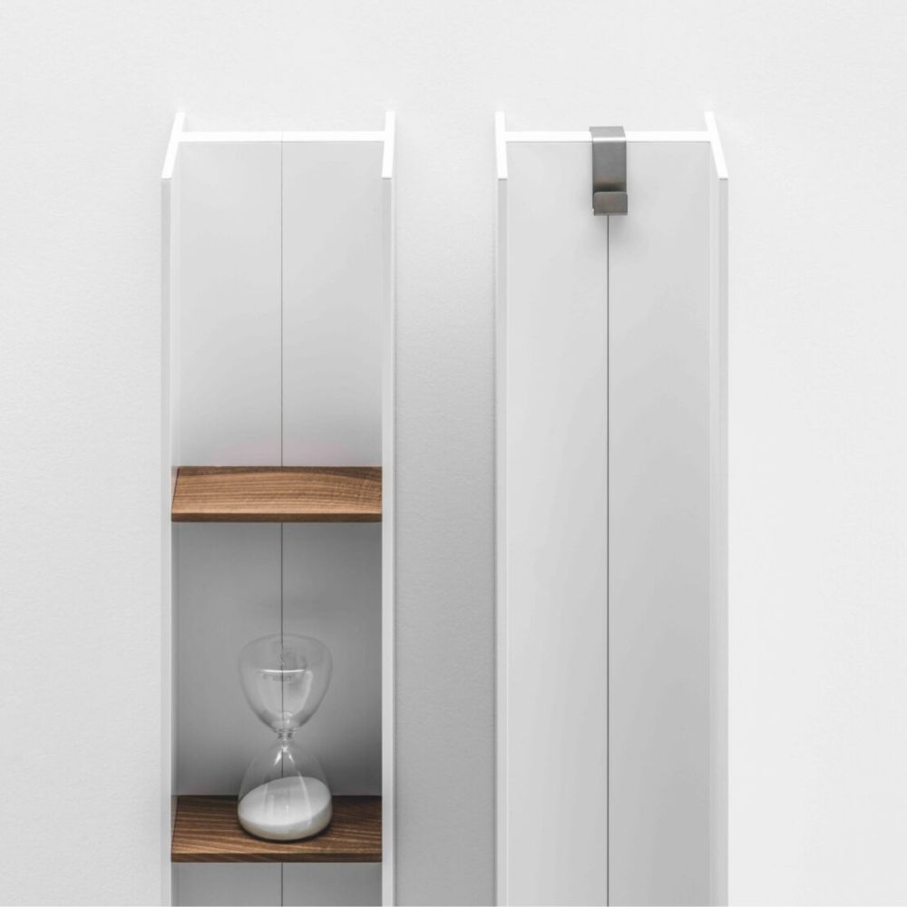 Sleek vertical radiator with integrated wood shelves. A modern radiator shelf solution that blends storage with minimalist style.