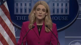 Karoline Leavitt (Ashley Padilla) addresses the media on Saturday Night Live.