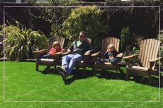 Dad sat on a chair with two children either side of him