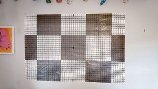 The grid-like sheet of paper used to install the GE Cync neon rope lights