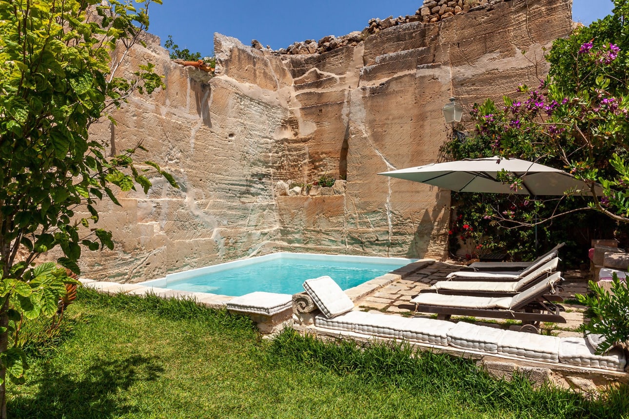 Swimming pool carved into a limestone quarry