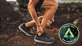 Trail runner holding injured ankle